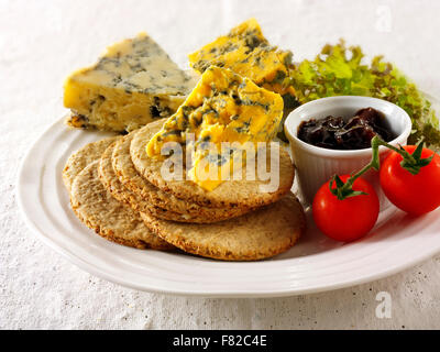 Blue cheese & biscuits with stilton, white stilton & blacksticks cheese. Served on a plate Stock Photo