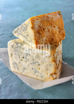 close up of a wedge of blue Cheese - Creamy Stilton ( bottom) Stilton above. Stock Photo