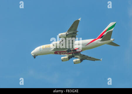 The biggest airplane of the world the A380 of Emirates flying over Assendelft a Village in the Netherlands to land in Amsterdam. Stock Photo