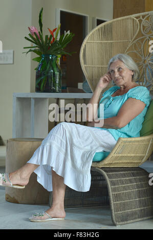 senior woman resting in hotel hall Stock Photo