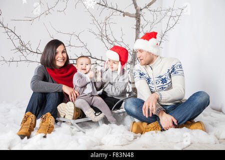 Family with children smiling celebrating New Year Stock Photo