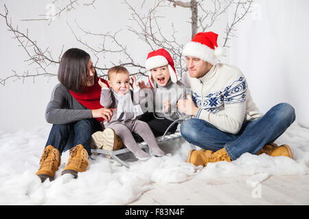 Family with children smiling celebrating New Year Stock Photo