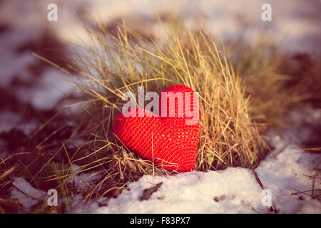 red heart handmade on snowy ground vintage edited Stock Photo