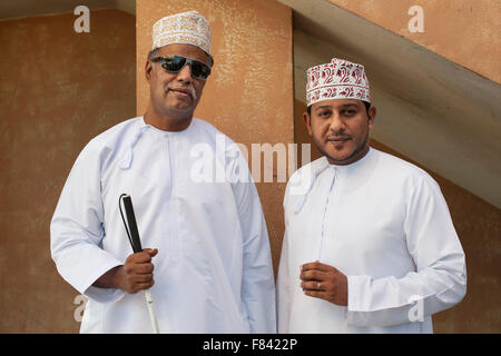 Two Omani men standing outside the Mutrah souk in Muscat, the capital of the Sultanate of Oman. Stock Photo