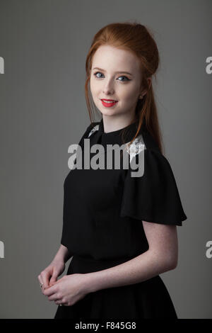 Portrait of a redheaded young woman with pale skin. Stock Photo