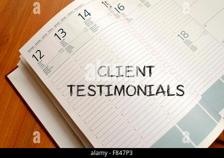 Client testimonials text concept write on notebook Stock Photo