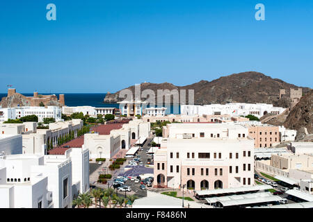 View of Al Mirani fort, Al Alam palace and government buildings in Old Muscat, part of the capital of the Sultanate of Oman. Stock Photo