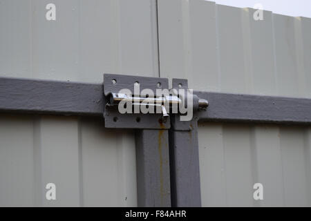 Latch on gate. A design for locking of gate from within. Stock Photo