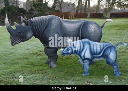 A pair of Longleat Festival of Light wire framed silk Rhino animals (parent and young) in the gardens of the main house