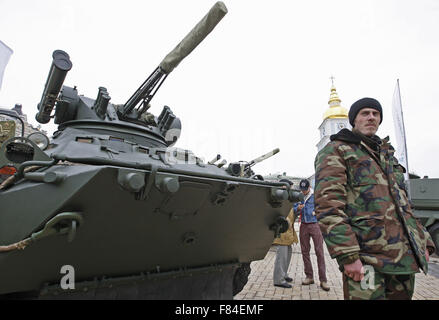 Kiev, Ukraine. 05th Dec, 2015. Ukrainian serviceman stand near the BTR-3, during the opening of the military exhibition 'Weapons of victory' during the Day of the Armed Forces of Ukraine at St. Michael's Square. The exhibition presents Ukrainian armored personnel carriers BTR-3 and BTR-4, and the new armored car Dozor-B, which will soon be sent to the East of Ukraine. © Vasyl Shevchenko/Pacific/Alamy Live News Stock Photo
