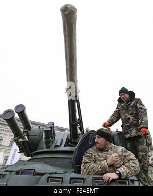 Kiev, Ukraine. 05th Dec, 2015. Ukrainian servicemen on the BTR-3, at the opening of the military exhibition 'Weapons of victory' during the Day of the Armed Forces of Ukraine at St. Michael's Square. The exhibition presents Ukrainian armored personnel carriers BTR-3 and BTR-4, and the new armored car Dozor-B, which will soon be sent to the East of Ukraine. © Vasyl Shevchenko/Pacific/Alamy Live News Stock Photo