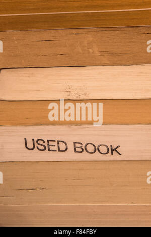 Paper texture of close composition of stack of well worn used books Stock Photo