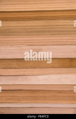 Paper texture of close composition of stack of well worn used books Stock Photo