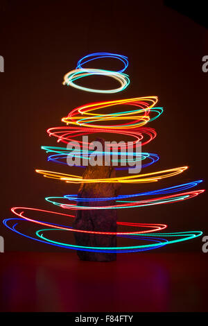 Light painting to create an abstract Christmas tree Stock Photo