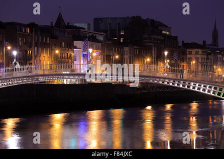 The night view of Ha'penny Bridge over River Liffey. Dublin Ireland Stock Photo