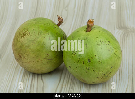 Asian fruit Sapote - on wood background Stock Photo