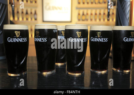 Pints of Guinness Draught beer on top of bar counter of the testing room of Guinness Storehouse. Dublin Ireland Stock Photo