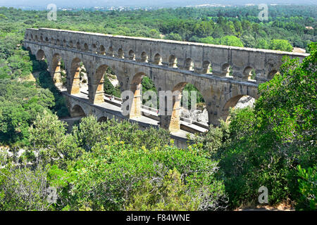Pont du Gard ancient Roman aqueduct spanning the Gardon River with the adjacent road added alongside Stock Photo