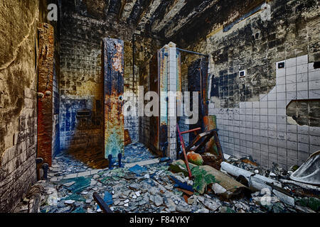 Mental Hospital Bathroom in abandoned ruin building Stock Photo