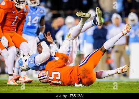 UNC quarterback Marquise Williams (12) is sacked by Clemson safety T.J. Green (15) during the ACC College Football Championship game between North Carolina and Clemson on Saturday Dec. 5, 2015 at Bank of America Stadium, in Charlotte, NC. Jacob Kupferman/CSM Stock Photo