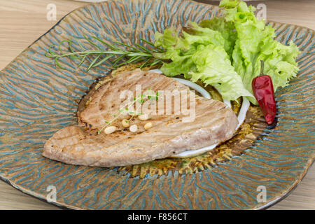 Grilled tuna steak with rosemary and cedar nut Stock Photo