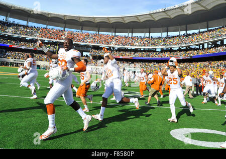 Waco, Texas, USA. 05th Dec, 2015. Texas players run onto the field celebrating after an NCAA college football game between the Texas Longhorns and Baylor Bears at McLane Stadium in Waco, Texas. Texas won 23-17. Austin McAfee/CSM/Alamy Live News Stock Photo