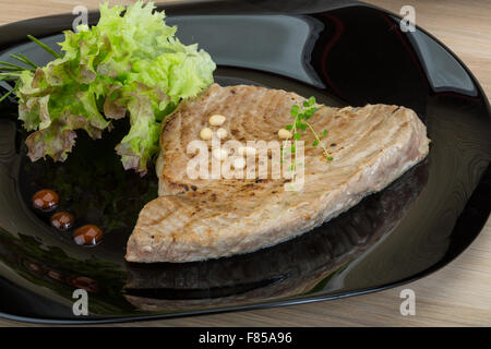 Grilled tuna steak with rosemary and cedar nut Stock Photo