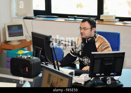 radio station dj reading news and info Stock Photo