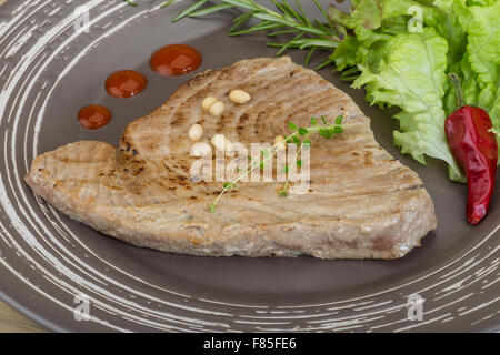 Grilled tuna steak with rosemary and cedar nut Stock Photo