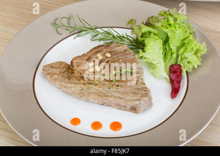 Grilled tuna steak with rosemary and cedar nut Stock Photo