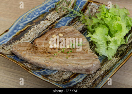 Grilled tuna steak with rosemary and cedar nut Stock Photo