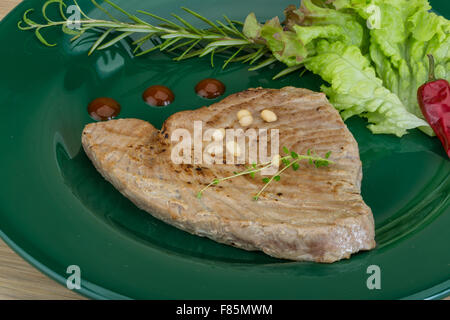 Grilled tuna steak with rosemary and cedar nut Stock Photo