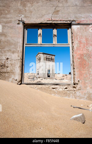 Window framing ruins in Kolmanskop Ghost Town - Luderitz, Namibia, Africa