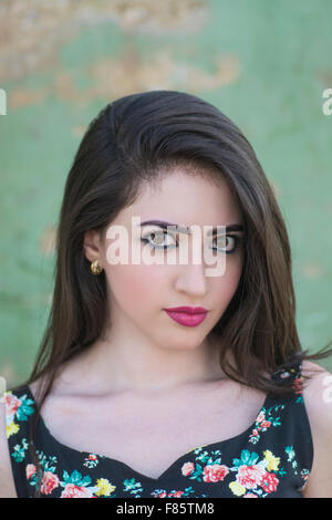 Serious young woman staring outdoors Stock Photo