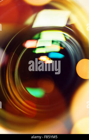 Photographic camera lens close up front view with bokeh light Stock Photo