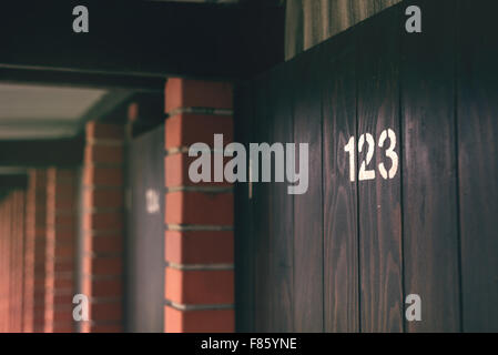 Beach cabin door number 123, retro toned image with selective focus Stock Photo