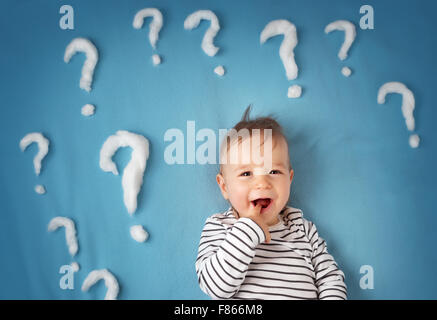 little boy with lots of question marks Stock Photo