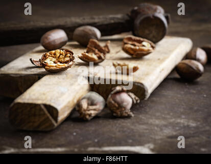 Still life with pecans on a wooden table Stock Photo