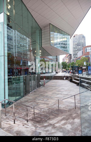 new york, 12 september 2015: people sit in front of Juilliard school on Lincoln Center Plaza, New York, NY Stock Photo