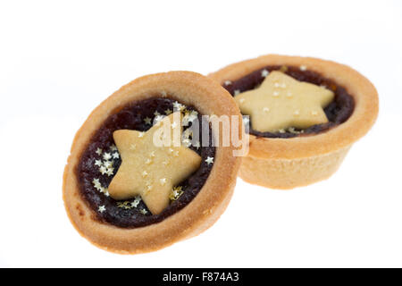 Christmas mince pies with stars - studio shot with a white background and a shallow depth of field. Stock Photo