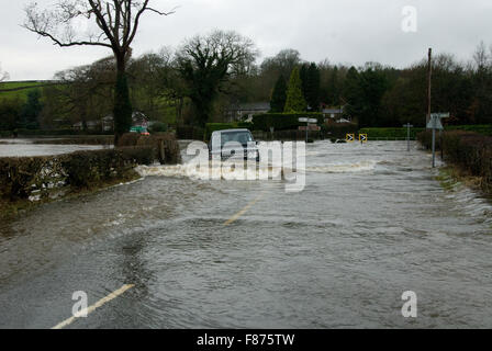 The driver of a Land Rover Discovery is not deterred by extreme flooding in Sawley, Lancashire caused by Storm Desmond. Stock Photo