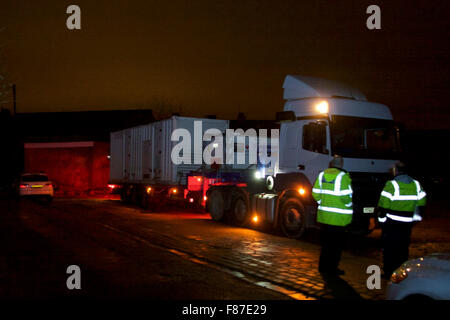 Bold Street, Morecambe, Lancashire, UK. 7th December 2015.  A 110Kva Emergency Generator which has been brought from London, is reversed into position adjacent to the sub station in Bold Street Morecambe   Electricity North West have deployed the Generators in an effort to restore power supplies to part of the Network which has been effected by the flooding from the River Lune which flooded the 33Kva Sub Station Supplying 55,000 homes in Lancaster, Morecambe and the surrounding Areas. Credit:  David Billinge/Alamy Live News Stock Photo