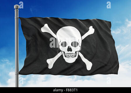 Pirate flag waving on blue background. Stock Photo