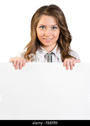 Young girl holding a blank white sheet of paper Stock Photo