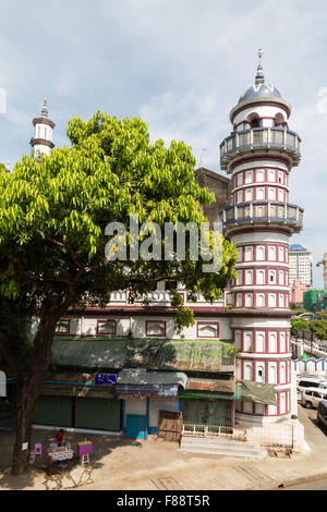 Yangon has many colonial buildings from the British rule, many are in bad condition, this building has a well preserved tower Stock Photo