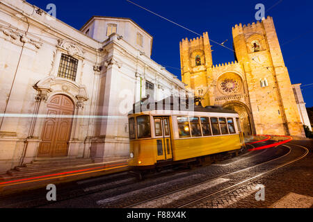 Tram in front of the Lisbon Cathedral at night Stock Photo