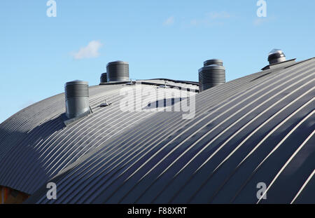 Roof detail on the MyPlace youth centre in Hackney, showing curved zinc cladding and wind catcher ventilation outlets Stock Photo