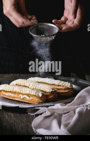 Eclairs in metal plate Stock Photo