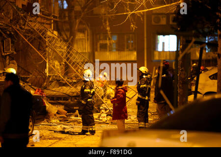 Rescue workers stand in front of a club after massive fire broke out ...