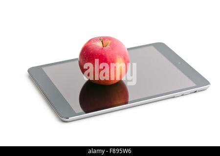 red apple and computer tablet on white background Stock Photo